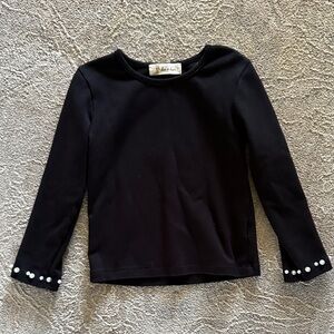 Doe A Dear black top with pearl cuffs